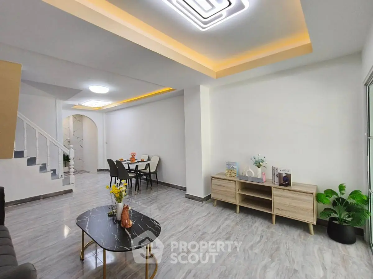 Modern living room with stylish ceiling lights and elegant decor
