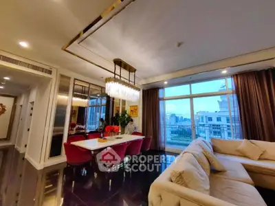 Luxurious living room with elegant chandelier and city view