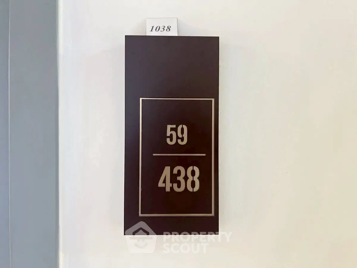Modern apartment door number sign with sleek design, perfect for contemporary living spaces.