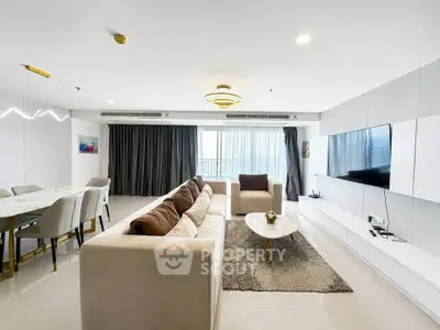 Spacious modern living room with elegant decor and large windows