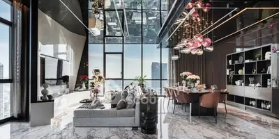 Luxurious modern living room with panoramic city views and elegant decor.