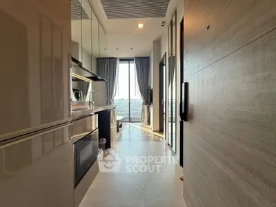 Modern kitchen with sleek design and large windows offering stunning views.