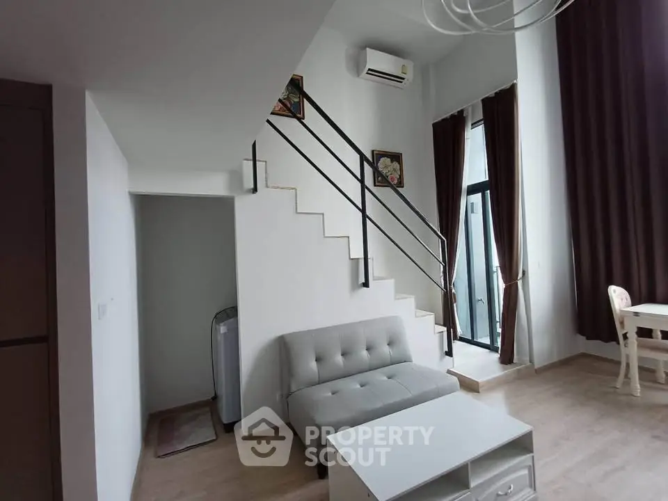 Modern duplex living room with high ceilings and stylish decor