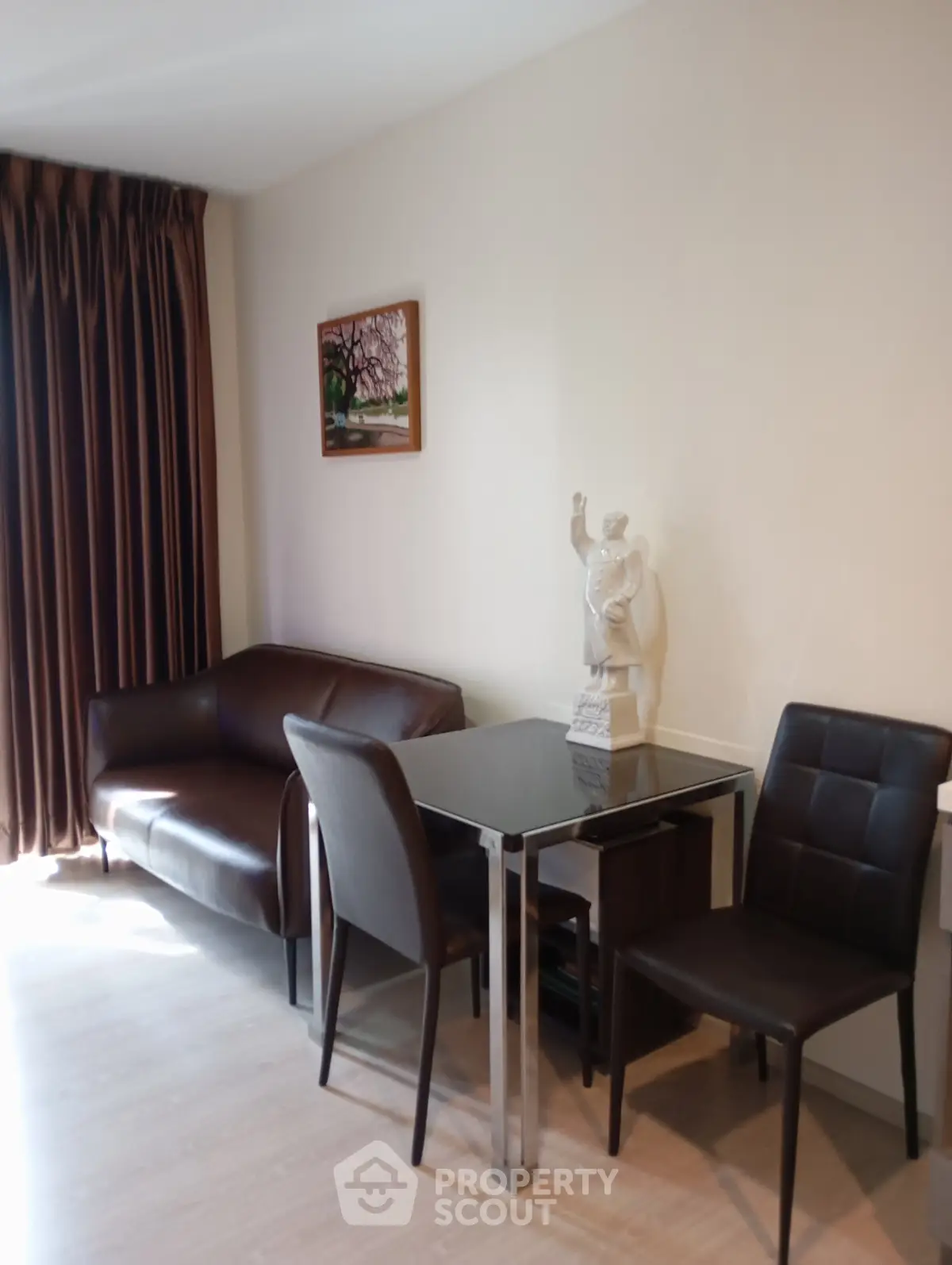Modern living room with sleek furniture and elegant decor in a stylish apartment.