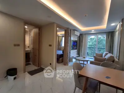 Modern apartment interior with open living area and balcony view