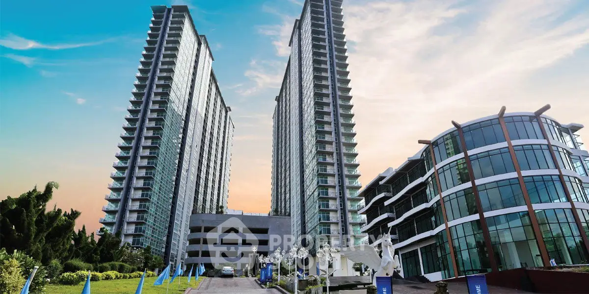 Stunning modern high-rise buildings with lush landscaping and clear blue sky.