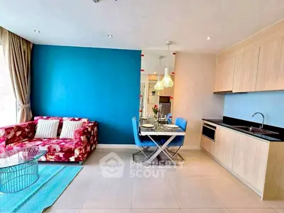 Stylish modern living room with vibrant decor and sleek kitchen design