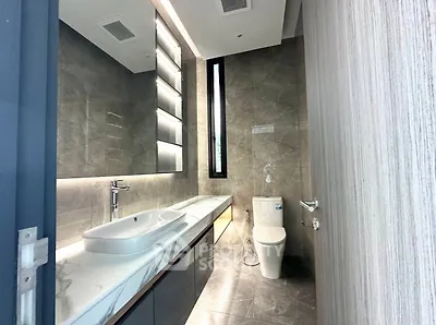 Luxurious modern bathroom with sleek fixtures and elegant lighting