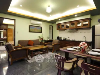 Elegant living room with modern kitchen and stylish furniture in open layout