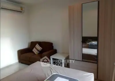 Cozy bedroom with air conditioning and modern wardrobe in a stylish apartment.