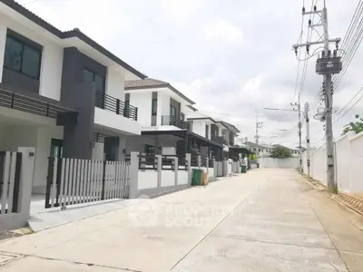 Modern townhouse row with sleek design and spacious layout in a serene neighborhood.
