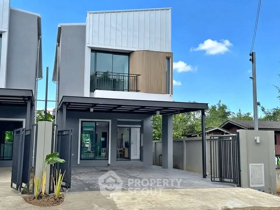 Modern two-story house with sleek design and spacious driveway in a serene neighborhood.