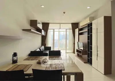 Modern living room with sleek furniture and city view from large windows