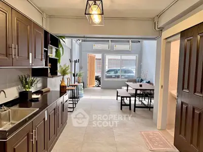 Spacious open-plan kitchen and living area with modern decor and natural light.