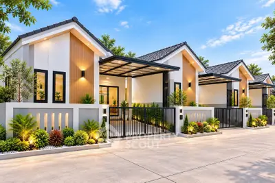 Modern single-story homes with sleek design and lush landscaping in a serene neighborhood.