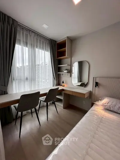 Modern bedroom with study area and large window view