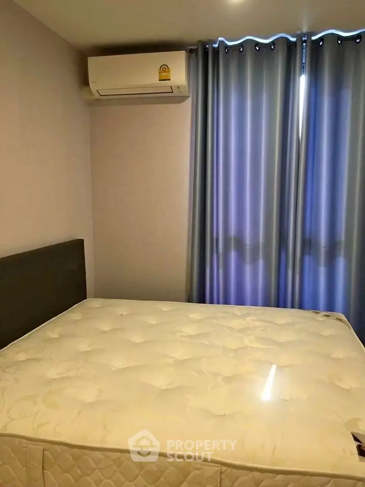 Cozy bedroom with air conditioning and soft lighting, perfect for restful nights.