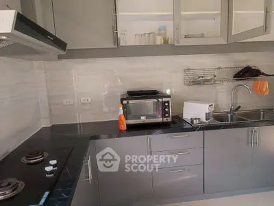 Modern kitchen with sleek cabinetry and built-in appliances