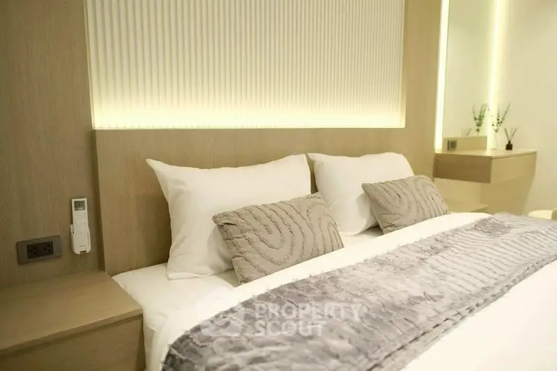 Luxurious modern bedroom with elegant decor and ambient lighting