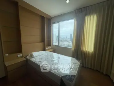 Modern bedroom with city view and natural light in high-rise apartment