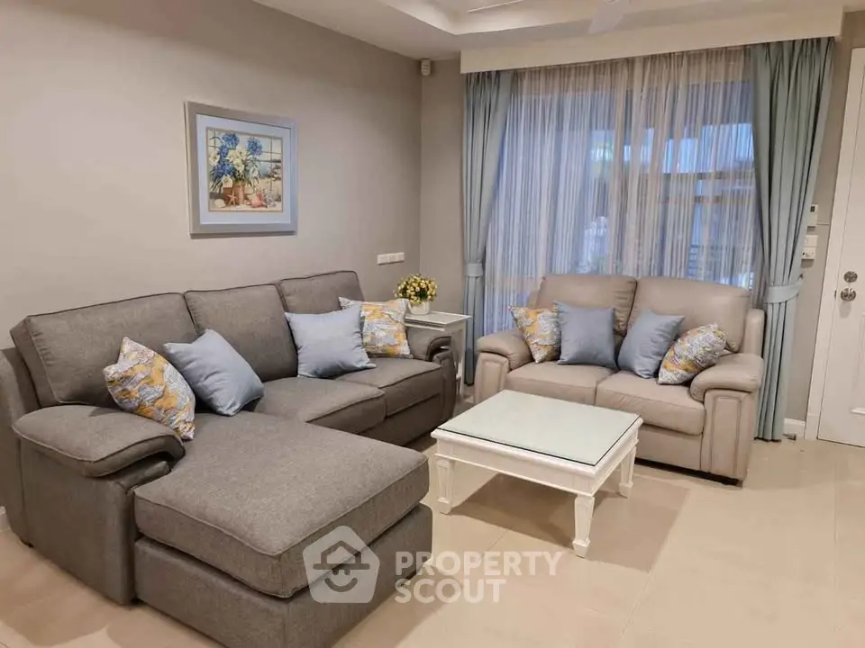 Elegant living room with cozy gray sofas and stylish decor