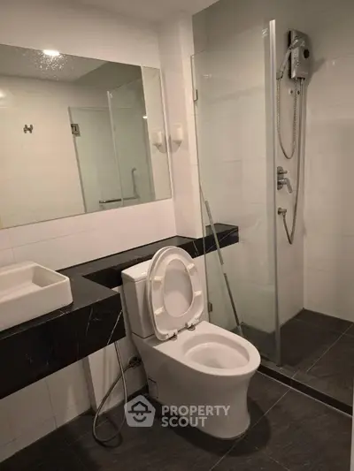 Modern bathroom with sleek design and glass shower enclosure