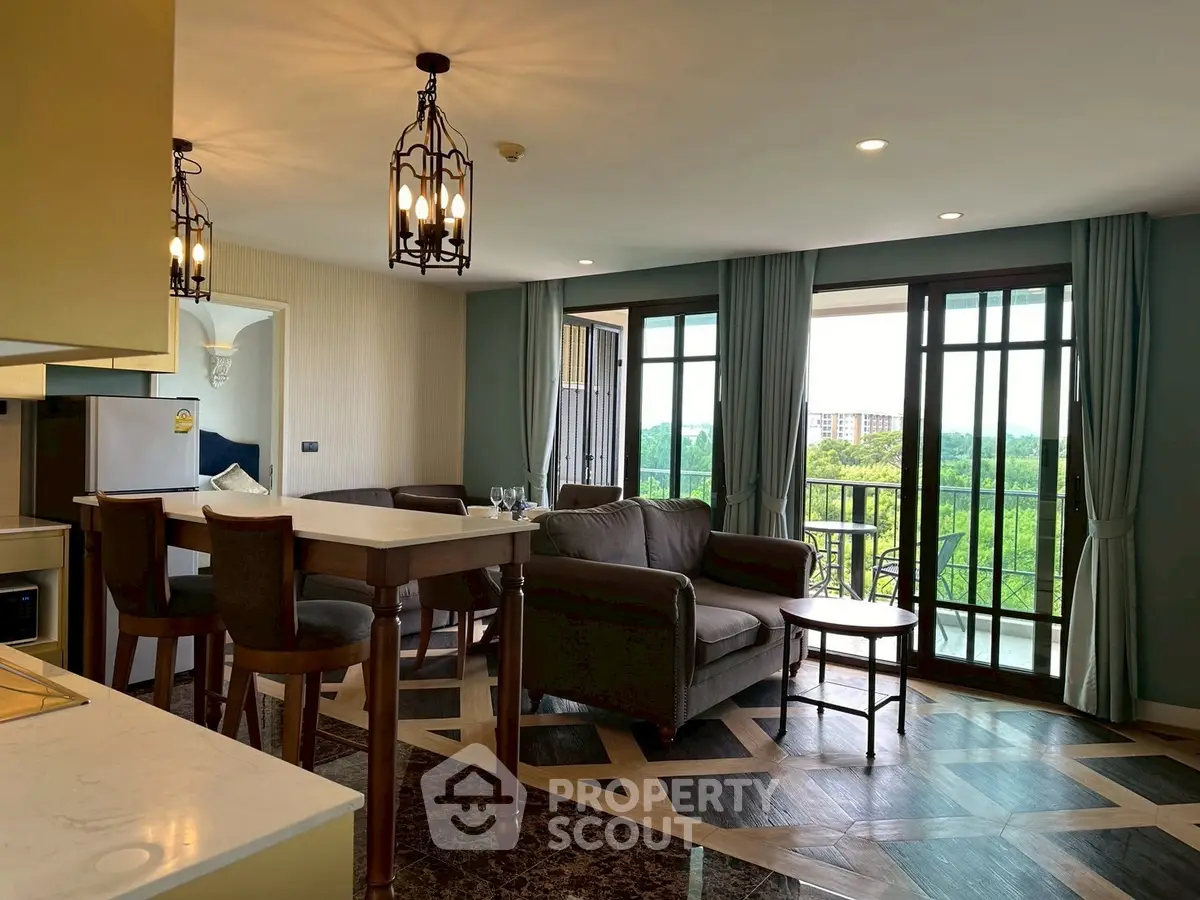 Spacious living room with elegant decor and balcony view