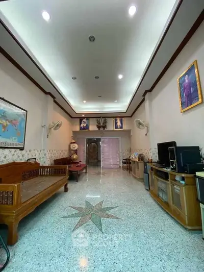 Spacious living room with high ceiling and elegant decor