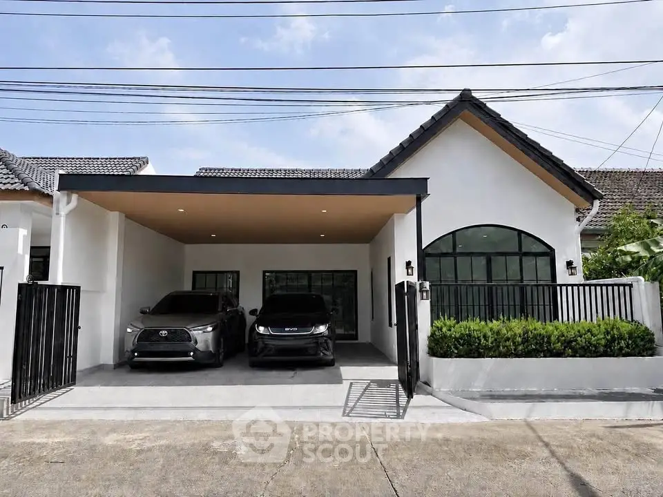 Charming modern house with spacious carport and sleek exterior design, perfect for family living.