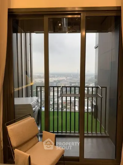 Modern apartment balcony with city view and washing machine