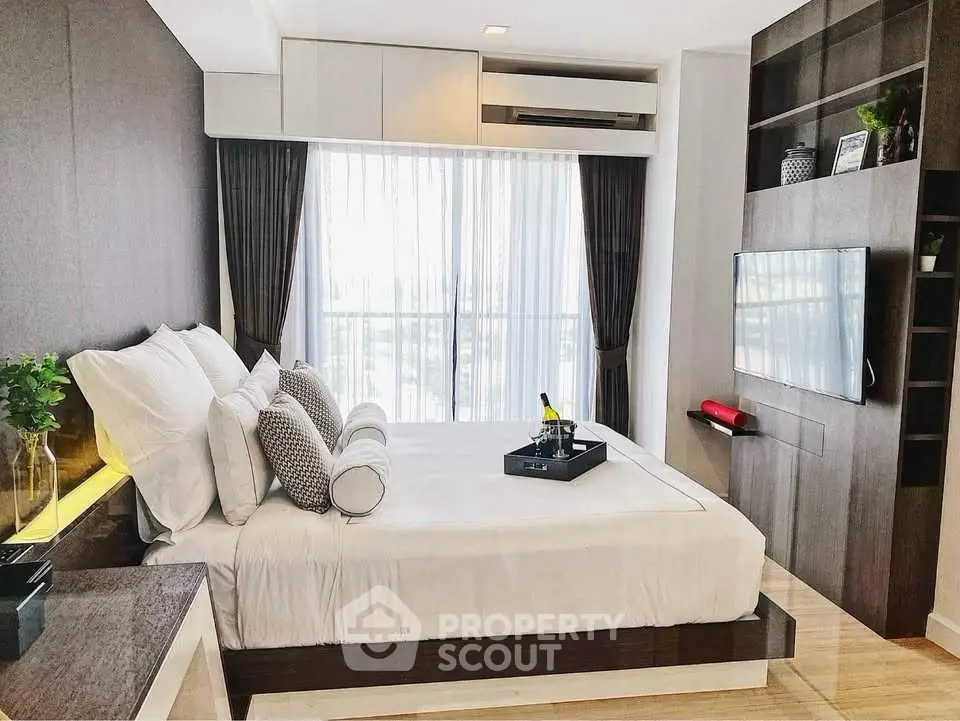 Luxurious modern bedroom with elegant decor and large window view