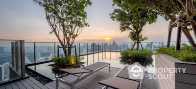 Luxurious rooftop terrace with stunning city skyline view and modern lounge chairs.