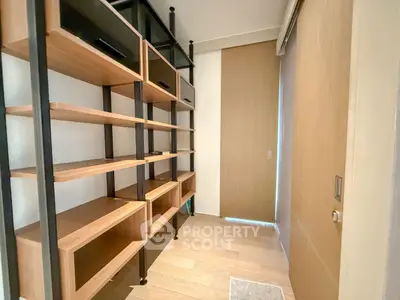 Spacious storage room with modern wooden shelving and sliding door