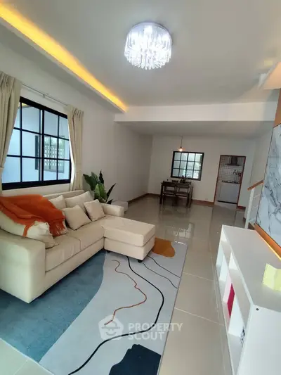 Spacious modern living room with elegant decor and natural light