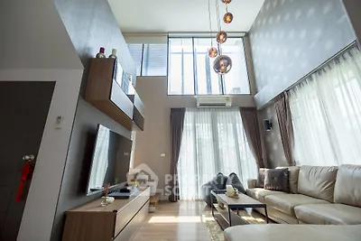 Luxurious modern living room with high ceilings and elegant decor