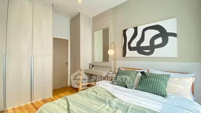 Modern bedroom with stylish decor and ample natural light