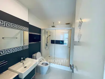 Modern bathroom with sleek design and spacious shower area