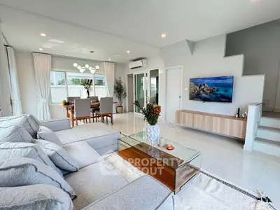 Spacious modern living room with elegant decor and dining area