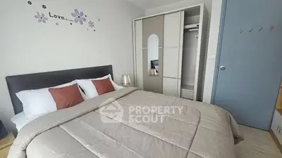 Cozy bedroom with modern decor and ample storage space