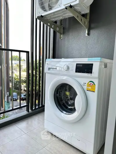 Modern balcony with washing machine and air conditioning unit