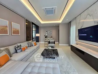 Luxurious modern living room with elegant decor and spacious seating area.