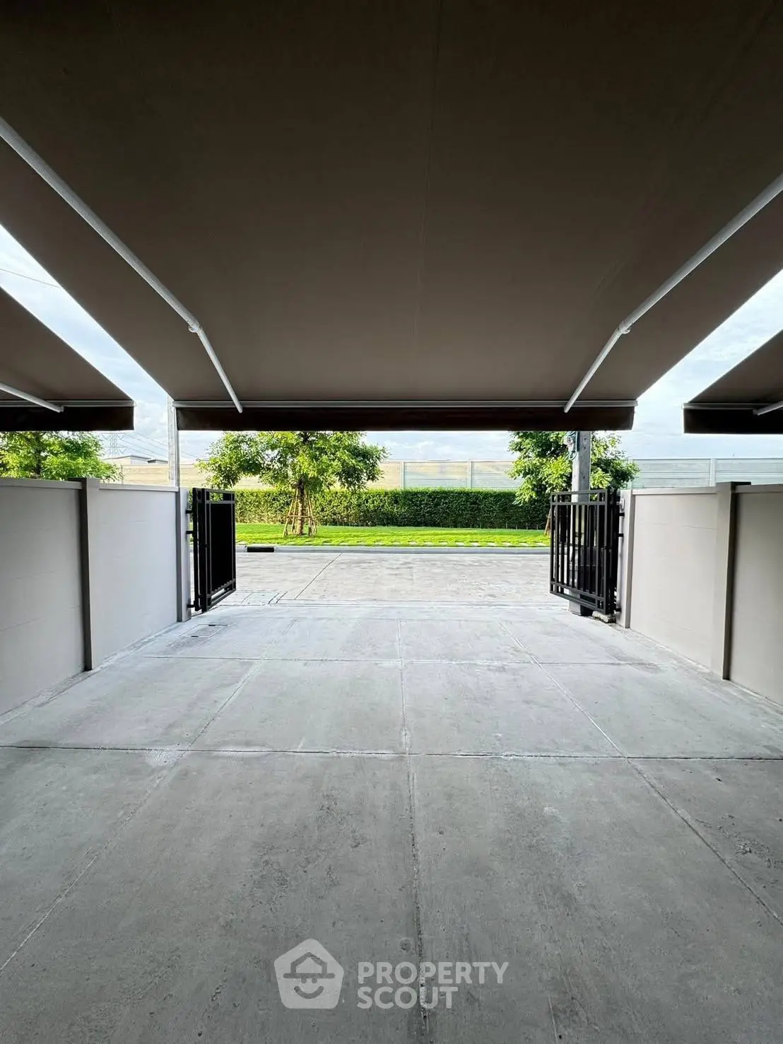 Spacious modern parking area with sleek design and gated entrance