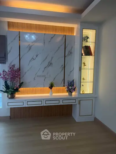 Elegant living room with modern built-in shelves and stylish lighting