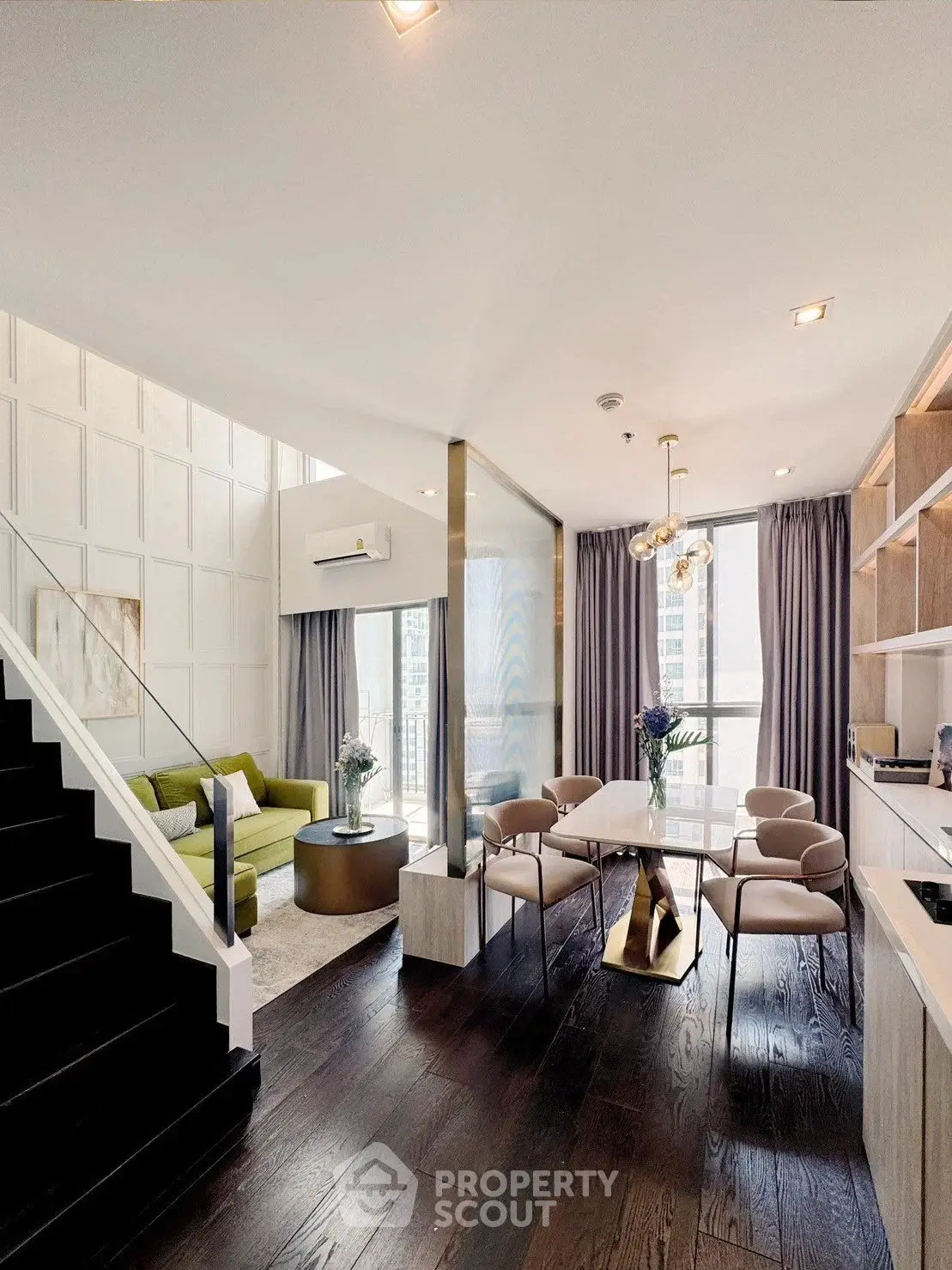 Luxurious modern living room with open kitchen and elegant dining area in high-rise apartment