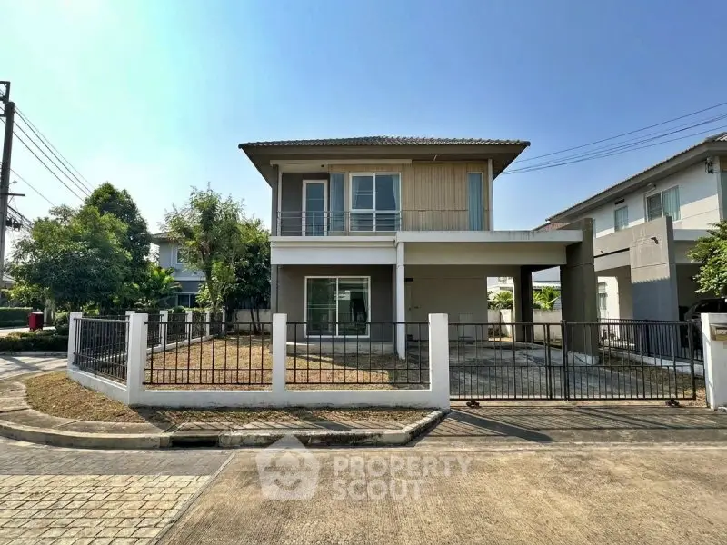 Charming two-story house with spacious yard and modern design in a serene neighborhood.