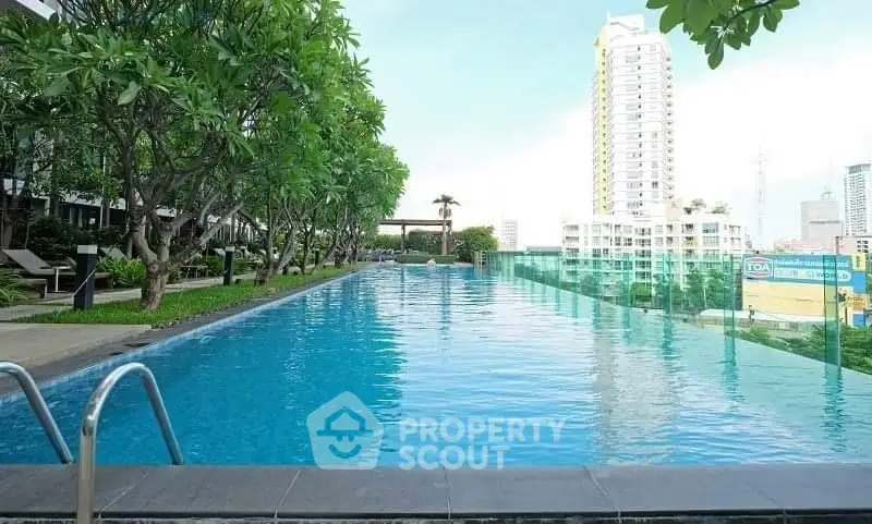 Luxurious rooftop pool with stunning city views and lush greenery