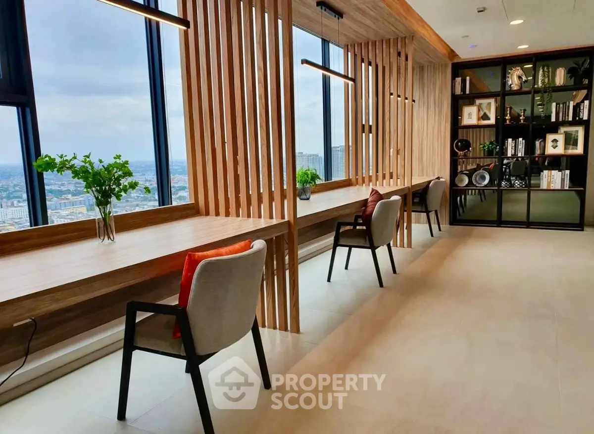 Modern co-working space with panoramic city views and stylish decor