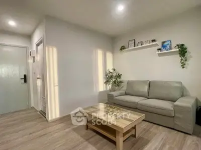 Modern living room with cozy sofa and stylish decor in a bright apartment.