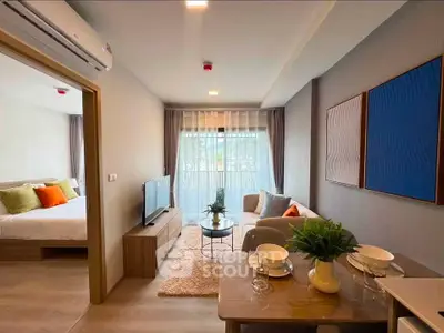 Modern living room with open layout and stylish decor in a cozy apartment.