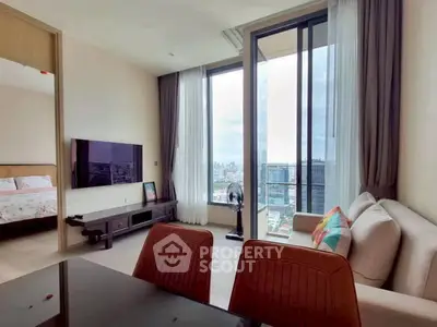 Modern living room with city view, stylish decor, and natural light